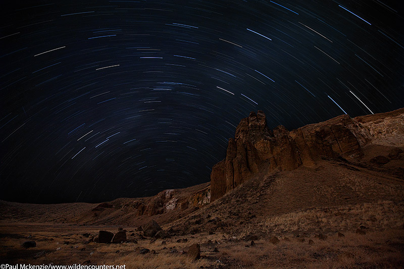 3a. Star trails over crater walls, double exposure, Central Island, Lake Turkana, Kenya